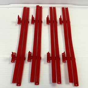 Four red guard rails for model train track, laid out horizontally for SCX 4RGR