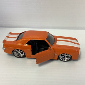 Orange diecast model of a 1969 Chevy Camaro with open hood for Jada 96949