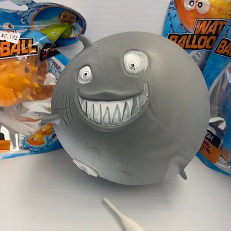 Gray, cartoonish water balloon toy with a wide, toothy grin for BVP 88621