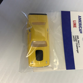 Yellow die-cast model car of a Dodge Challenger for American Line B411