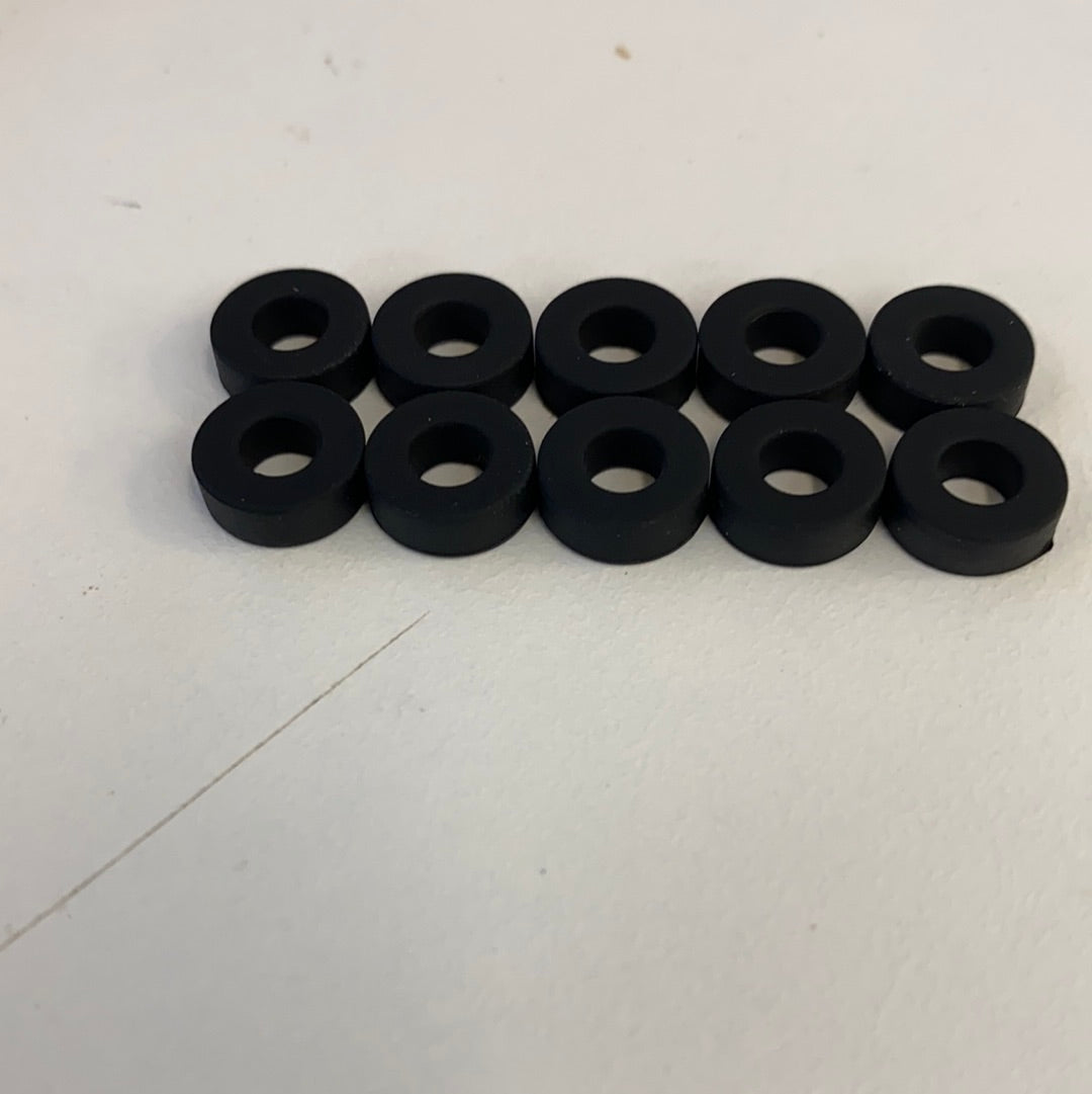 Ten black slot car front tires arranged in two rows for Auto World CP7910, front view