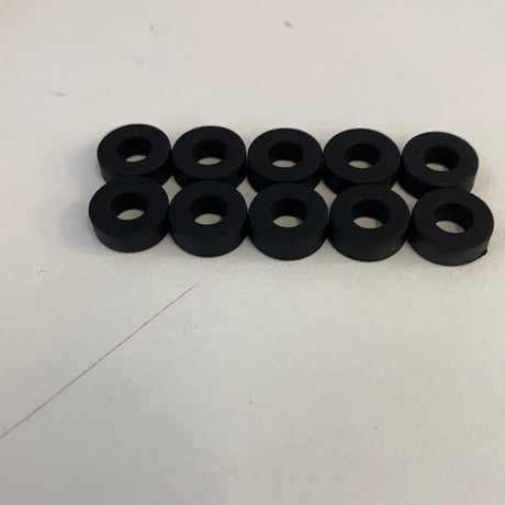 Ten black slot car front tires arranged in two rows for Auto World CP7910, front view