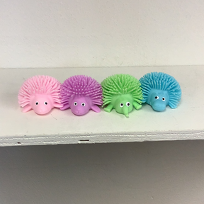 Colorful, soft hedgehog squeeze balls in pink, purple, green, and blue for IMEX-Toys 88323BA, front view