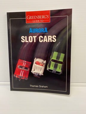 Guidebook featuring three slot cars: red, silver, and green for Thomas Graham 9000