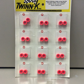 Assortment of hot pink silicone tire-shaped gumball-like components for Gum Drops Silicone Day-Glo Hot Pink Tires 019