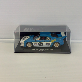 Blue BMW M1 race car model in clear plastic display case for Fly Car 88205
