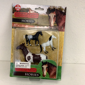 Assortment of four plastic horse animal figures in clear packaging for The Nature Zone IMX49582