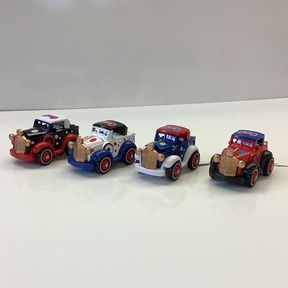 Four vintage die-cast police cars lined up on a white surface for IMEX-Toys 88433TY