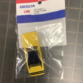 Yellow die-cast model of a Dodge Charger car in packaging for American Line B407