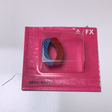 Two circular magnets in a pink plastic package for Aurora / AFX / Tomy 502