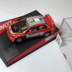Red Mitsubishi WRC show car model on display base for NINCO 50394