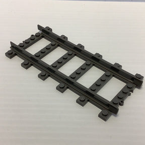 Black straight train track pieces, laid out in a row for Railroad Conveyance Trains AUS25953