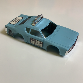 Blue toy taxi cab with "AURA CAB" lettering on the side for Aurora / AFX / Tomy B1939B