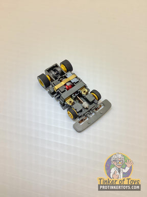 Assembled grey and yellow toy car chassis with wheels for Tyco TCR TCR1501