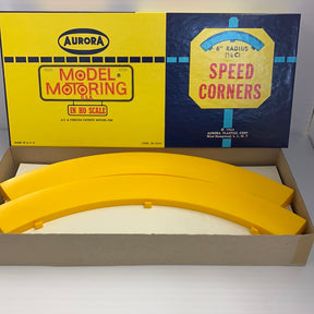 Yellow curved plastic track pieces for model trains, set of four for Aurora Model Motoring 1598