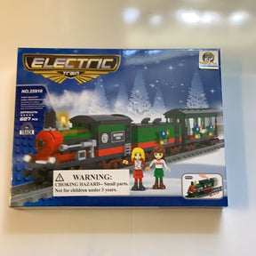Toy train set box showing a red and green electric train and two figures for AUS25910