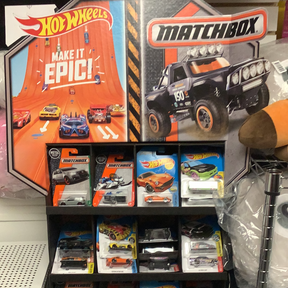 Toy car display featuring Hot Wheels and MatchBox assortments for UPD 30782
