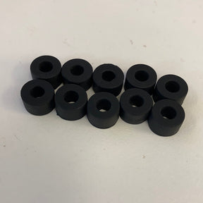 Ten black slot car rear tires, small and uniform in size for Auto World CP7911