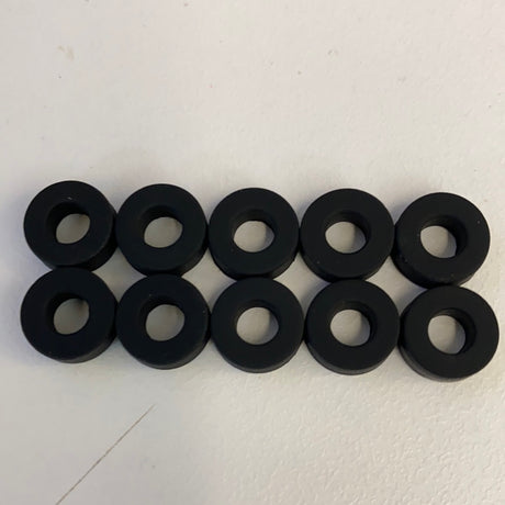 Ten black slot car front tires arranged in two rows for Auto World CP7910, rear view