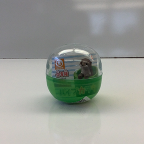 Cute otter toy inside a clear, green, spherical capsule for BC USA 70810