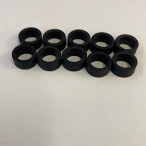 Set of ten black slot car rear tires for model cars for Auto World CP7909, front view