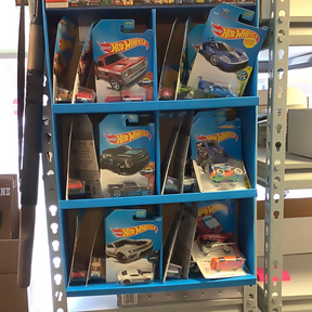 Assorted die-cast cars displayed on blue shelving units for DVB83-D9B0H l2503lAssorted CARS