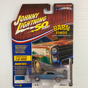 Die-cast model of a 1969 Dodge Charger Daytona in a barn finds display for Johnnny Lighting Die Cast JLMC020