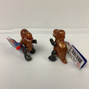 Two small, brown T-Rex toys with tags, displayed side-by-side for California Creations 80101