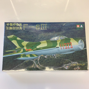 Model kit box art: Green and yellow F-6III fighter jet over a landscape for IMEX AA0011