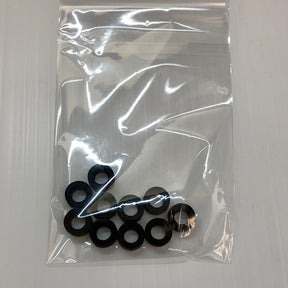 Set of ten black slot car rear tires in clear packaging for Auto World CP7907, package view, product view 1