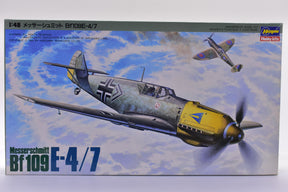 Scale model kit box art featuring a Messerschmitt Bf109 fighter plane for Hasegawa J002