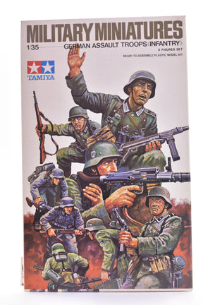 Box art showing German infantry soldiers in action, ready to assemble plastic model kit for Tamiya MM130