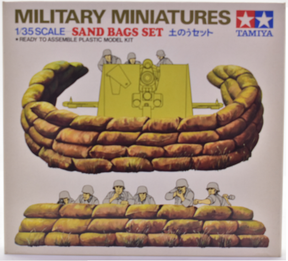 Model kit showing assembled sandbag fortifications and a sandbag gun emplacement for Tamiya MM125