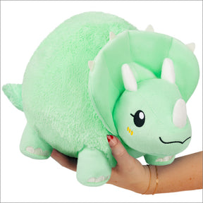 Green, plush triceratops toy with soft texture, held by hands for Squishable SQU-114744