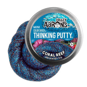 Blue, sparkly thinking putty in a tin container for Crazy Aaron's CR003