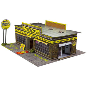 Model kit of a motorcycle shop building with signage and display windows for Innovative Hobby Supply BK3201