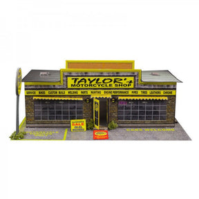 Model kit of a motorcycle shop with detailed facade and signage for Innovative Hobby Supply BK6401