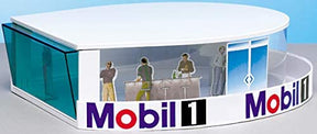 Diorama set showing figures and a "Mobil 1" sign for Carrera 21103