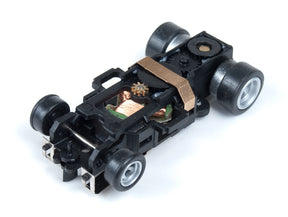 Black slot car chassis with wheels and visible internal components for Auto World PSC4G-029