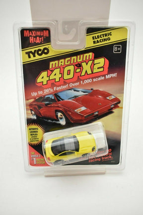 Red and yellow remote control cars in packaging for electric racing for Tyco 9141