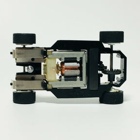 Electronic chassis with visible motor and components, viewed from the side for Tyco