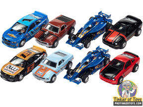 Set of eight slot car race cars in various colors and models for Auto World SC383