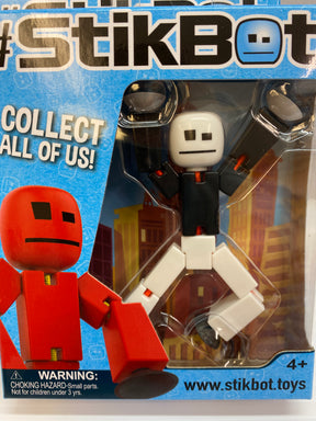White and black StikBot figure in clear plastic packaging for TST616