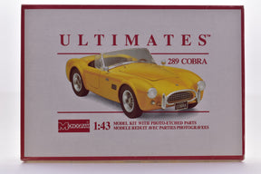 Yellow 1:43 scale model kit box art featuring a Cobra car for Monogram Models 3596