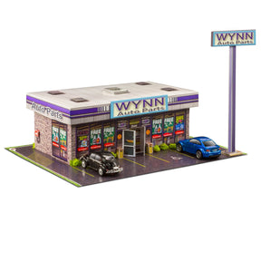 Model kit of an auto parts store with cars parked in front for Innovative Hobby Supply BK6435